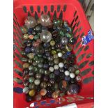 Plastic basket of marbles The-saleroom.com showing catalogue only, live bidding available via our