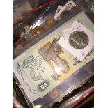 A box of world coins and banknotes including fakes. The-saleroom.com showing catalogue only, live bi