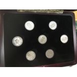 A collection of English shillings in a case. The-saleroom.com showing catalogue only, live bidding