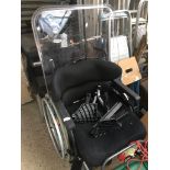 A wheelchair with plastic tray The-saleroom.com showing catalogue only, live bidding available via