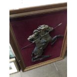 A cavalier on horse, resin figure on velvet, in large frame. The-saleroom.com showing catalogue