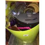 A plastic basket with various items to include coffee maker, glassware, juicer, kitchen items,