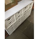 A painted utilitarian chest of drawers on large castors The-saleroom.com showing catalogue only,