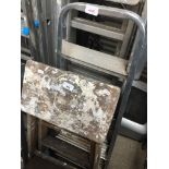 A small aluminium stepladder and small wooden stepladder. The-saleroom.com showing catalogue only,