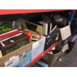 Four boxes of various items including books, mantel clock, pottery, steins, gent's travel set etc.
