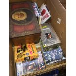 A box of misc DVDs and an old tin box The-saleroom.com showing catalogue only, live bidding