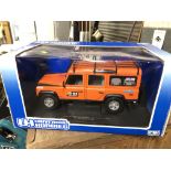 A boxed model Land Rover Defender. The-saleroom.com showing catalogue only, live bidding available