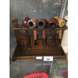 Wooden pipe rack and pipes The-saleroom.com showing catalogue only, live bidding available via our