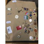 A collection of pin badges The-saleroom.com showing catalogue only, live bidding available via our