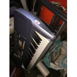 A Casio LH110 keyboard with stand. The-saleroom.com showing catalogue only, live bidding available
