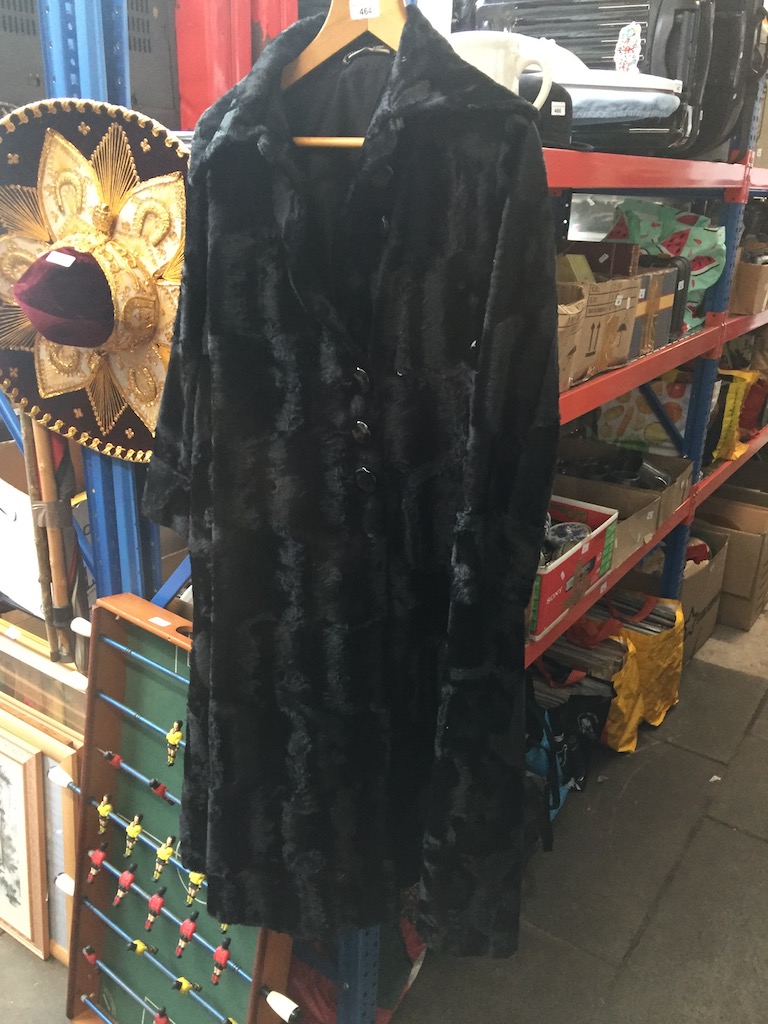 A black faux fur coat. The-saleroom.com showing catalogue only, live bidding available via our
