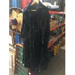 A black faux fur coat. The-saleroom.com showing catalogue only, live bidding available via our