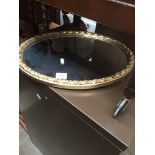 Oval gold frame mirror The-saleroom.com showing catalogue only, live bidding available via our