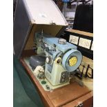 A Jones electric sewing machine with pedal and lead. The-saleroom.com showing catalogue only, live