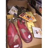 A box of misc including key rings, small ornaments, cigars and a pair of child's clogs The-