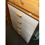 Chest of white and teak effect drawers The-saleroom.com showing catalogue only, live bidding