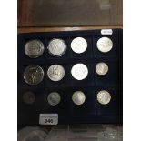 Three trays of maining commemorative coins. The-saleroom.com showing catalogue only, live bidding