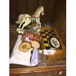 A wooden box travelling chess set, a draughts set and several small wooden figure ornaments The-