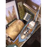 A box of misc to include ornaments, wooden ship models, pictures, etc. The-saleroom.com showing