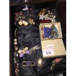 A tray with costume jewellery, earrings and a cloth with over 20 vintage brooches The-saleroom.com