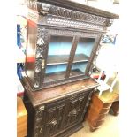 A Victorian carved Dutch style cabinet bookcase The-saleroom.com showing catalogue only, live