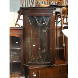 A reproduction mahogany corner display cabinet. The-saleroom.com showing catalogue only, live