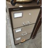 Three drawer brown metal filing cabinet The-saleroom.com showing catalogue only, live bidding
