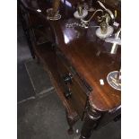 Regency period mahogany sideboard with turned legs and concave centre drawer The-saleroom.com