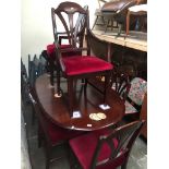 A reproduction extending dining table and eight chairs The-saleroom.com showing catalogue only, live
