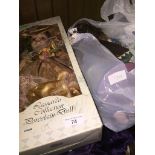 A boxed Leonardo Collection Porcelain Doll and a bag of dolls The-saleroom.com showing catalogue