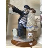 Nao figure of a sailor and girl The-saleroom.com showing catalogue only, live bidding available