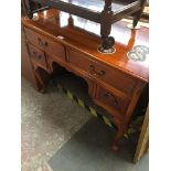 A reproduction yew wood low boy The-saleroom.com showing catalogue only, live bidding available