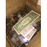 A box of world coins and banknotes The-saleroom.com showing catalogue only, live bidding available