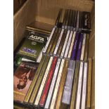 A box of CDs and music cassettes. The-saleroom.com showing catalogue only, live bidding available