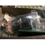 A box of motor racing collectors cards. The-saleroom.com showing catalogue only, live bidding