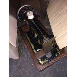 A vintage Singer handcranked sewing machine. The-saleroom.com showing catalogue only, live bidding