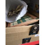 A box of kitchen items, cutlery, place mats, coasters etc The-saleroom.com showing catalogue only,