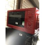 A red microwave The-saleroom.com showing catalogue only, live bidding available via our website.