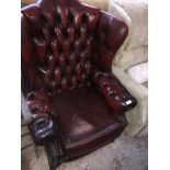 An oxblood leather chesterfield wing back armchair The-saleroom.com showing catalogue only, live