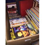 A box of magazines, DVDs, CDs, etc. The-saleroom.com showing catalogue only, live bidding