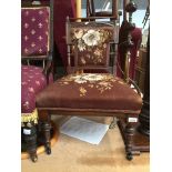 An Edwardian carved nursing chair with brown floral upholstery Catalogue only, live bidding