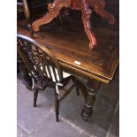 An oak drawer leaf dining table and 6 wheel back chairs Catalogue only, live bidding available via