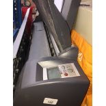 An HP Designjet, model number : C7791C - no power lead. Catalogue only, live bidding available via