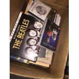 A box of books, CDs, DVDs, etc. Catalogue only, live bidding available via our website, if you