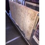 A beige ground eastern rug, 250cm x 157cm Catalogue only, live bidding available via our website, if