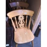 A set of four light wood country kitchen style chairs Catalogue only, live bidding available via our