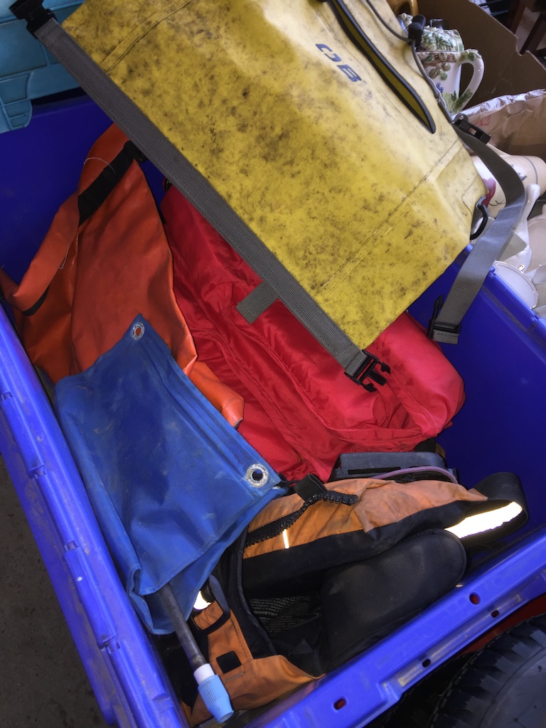 A box of dry bags and cayac buoyancy aid. Catalogue only, live bidding available via our website, if