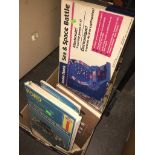 A box of books, a travel iron and an electronic game. Catalogue only, live bidding available via our