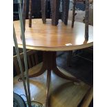A teak round dining table Catalogue only, live bidding available via our website, if you require P&P