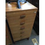 A G-Plan tall teak chest of drawers Catalogue only, live bidding available via our website, if you
